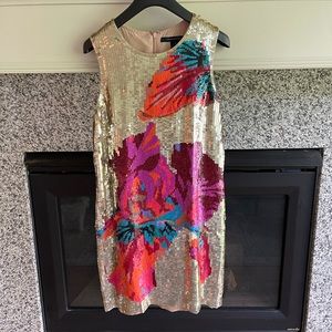 Gold sequin dress with colorful floral detail